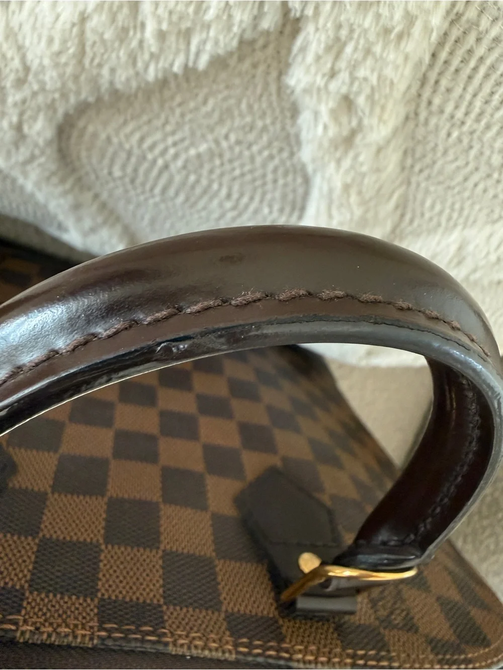 Louis Vuitton imperfections lock